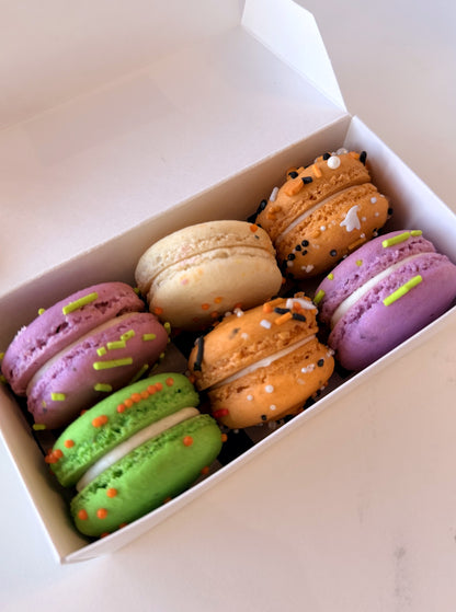 Six Halloween macarons in a box