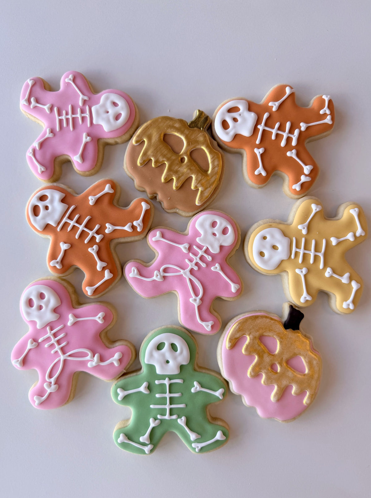 Decorated skeleton and pumpkin Halloween sugar cookies